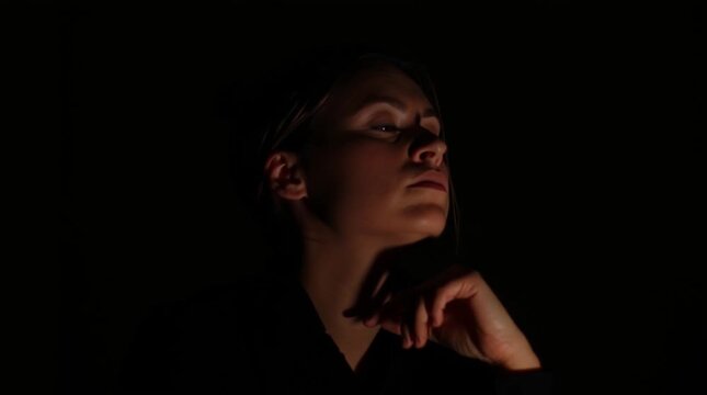 Contemplating woman is guessing in mysterious atmosphere. Psychic readings