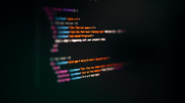 Colorful code snippet dark background blur. Abstract closeup of HTML CSS syntax highlighting glowing text on digital screen with dark blurred background, representing modern programming interface