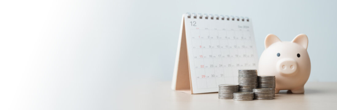 budget, planner, savings, piggybank, finance, goals, A pink piggy bank beside a calendar with stacked coins represents monthly savings planning, financial goals, and money management concepts.