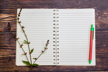 Blank notebooks placed on a wooden floor