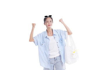 Joyful Traveler with shopping bag: A young woman radiates happiness, arms raised in a gesture of...