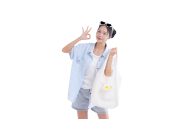 Joyful Summer: A vibrant young woman smiles confidently, conveying an okay hand gesture, and carries a chic tote bag, capturing the carefree spirit of a perfect summer day.