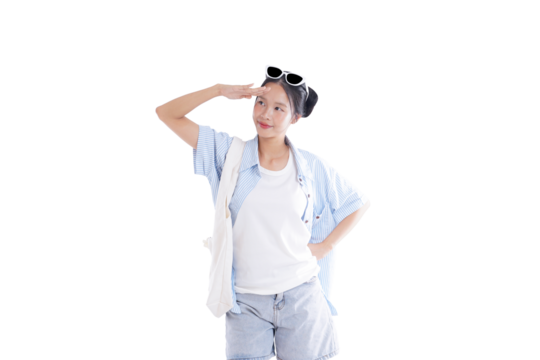 Young woman in a summer outfit: A young woman in a summer outfit gazes out with a salute, full of thought, on an adventure day.