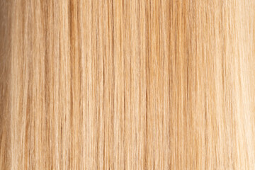 Macro view of healthy straight blonde hair texture. Ideal for backgrounds, product packaging, cosmetic mockups, salon ads, and wellness visuals.