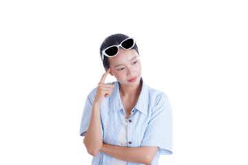Contemplative woman wearing sunglasses: A young woman in a blue shirt thoughtfully touches her temple while wearing sunglasses, indicating a moment of concentration and deep thinking.