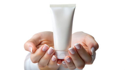 Womans hands holding a white cosmetic cream tube isolated on transparent background