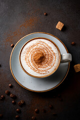Close-up of creamy cappuccino in clear cup inspiring educational interest in coffee art and promoting sustainable living through mindful consumption
