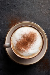 Elegant cappuccino served in glass cup inspiring educational curiosity and fostering appreciation for coffee diversity and cultural identity
