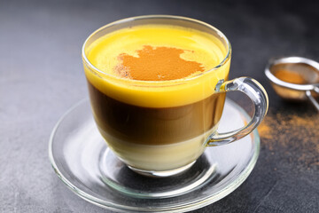 Beautiful Vietnamese egg coffee in glass cup surrounded by spices promoting educational curiosity and inspiring cultural heritage through culinary art
