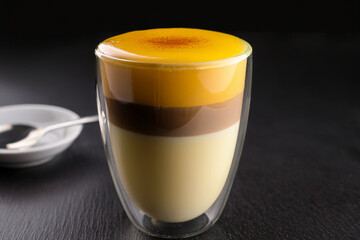 Elegant Vietnamese egg coffee served with cinnamon and star anise promoting educational interest and encouraging cultural appreciation among young learners
