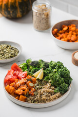 Healthy vegan buddha bowl with quinoa, pumpkin and vegetables. Vegetable recipes
