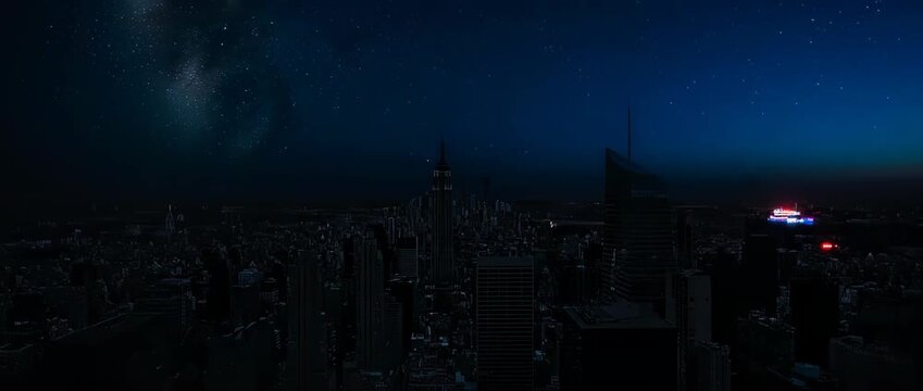City skyline going dark as lights turn off for Earth Hour, revealing a starry sky. Symbolizes energy conservation and awareness.