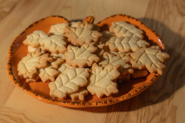 Homemade Autumn Leaf Cookies on an Orange Pumpkin Plate