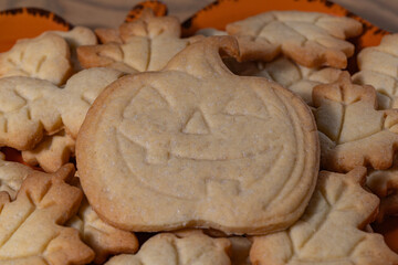 Homemade Halloween Jack-O'-Lantern and Leaf Cookies on a Plate
