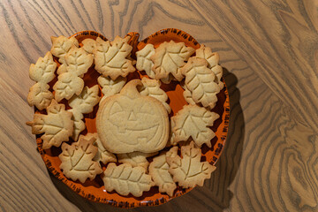 Homemade Halloween Jack-O'-Lantern and Leaf Cookies on a Plate