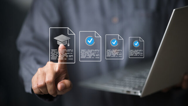 Businessman using laptop to validate online education certificates, digital learning verification concept