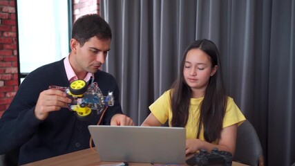 Girl coding robot simulation with teacher guiding her. - Powered by Adobe