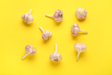 Fresh garlic on yellow background