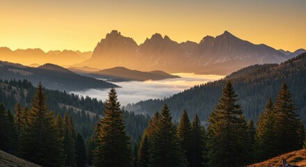 Obraz premium Majestic Mountain Peaks Bathed in Golden Sunrise Light Above a Misty Valley.