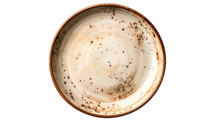 Overhead view of rustic plate, cream and brown swirls with speckled texture