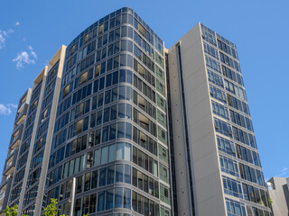 Obraz premium Residential and commercial Apartment building in inner west Sydney suburb , Sydney NSW Australia. Newly built apartment building in Wentworth point with modern Green eco friendly design