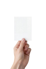 Hand holding blank white card against black background