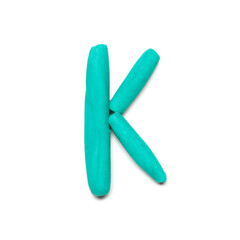 Letter K made of plasticine on white background