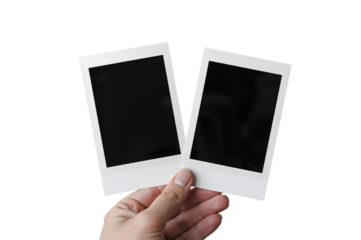 Hand Holding Two Blank Polaroid Frames Mockup