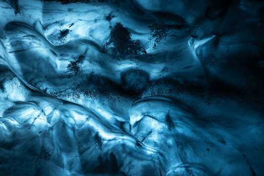 Detail of frozen blue ice pattern in an ice cave in Iceland