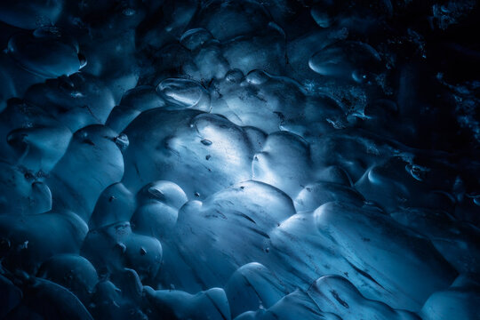 Frozen blue bubble patterns Inside an ice cave in Iceland