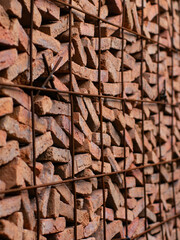 Stacked Red Clay Bricks in Construction Site - Traditional Building Materials Organized in Storage Rows for Architecture Project.