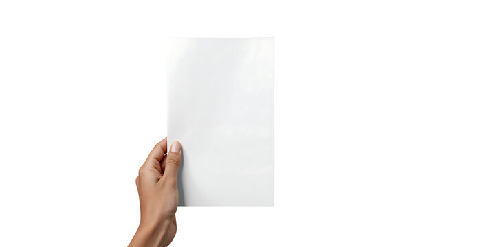 Womans hand holding blank white paper sheet against black background for mockup designs and advertising materials presentation