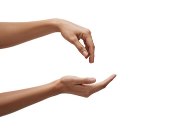 Two hands in a receiving and offering gesture isolated on black background concept of giving and caring support and generosity present