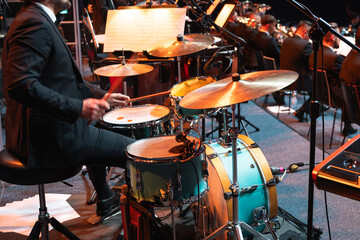 drummer plays the drums during a brass band concert