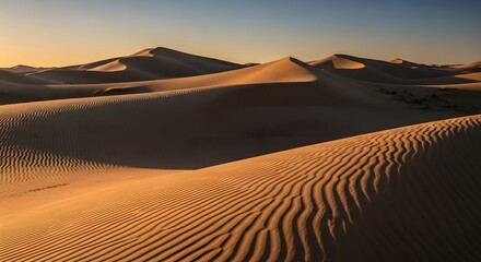Scenic view of sand dunes in desert landscape at sunset, golden hour