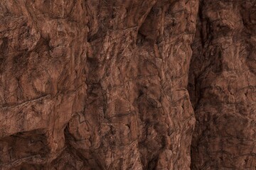 A detailed close-up of a rugged, weathered reddish-brown rock face, featuring deep crevices, varied textures, and strong shadows highlighting its natural, ancient surface