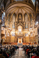 Experience the awe-inspiring beauty of Montserrat Monastery with its intricate architecture, golden details, and devoted congregation seeking spiritual solace and connection