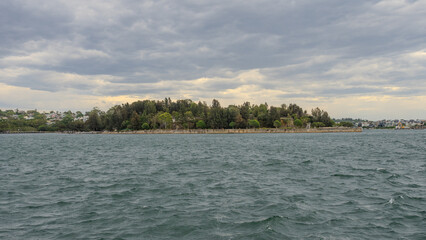 Residential Houses and apartment buildings on Parramatta River Sydney Harbour on a warm spring cloudy overcast day in Sydney NSW Australia