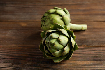 Close up of artichoke flowers in wooden board