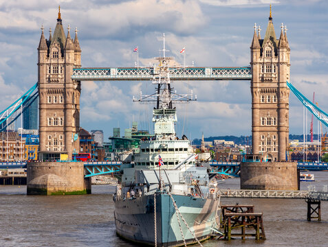 Tower bridge and Belfast warship on Thames river, London, UK