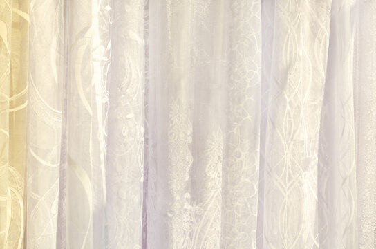 Sheer curtains, tulles with floral and geometric patterns in soft tones