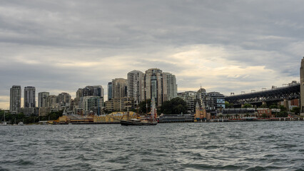 Obraz premium Residential Houses and apartment buildings on Parramatta River Sydney Harbour on a warm spring cloudy overcast day in Sydney NSW Australia 