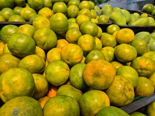 Close Up of fresh oranges arranged in a mart