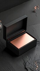 Elegant black box showcasing a stack of rose gold metallic business cards.