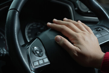 Fototapeta premium The driver is honking the horn to prevent an accident.