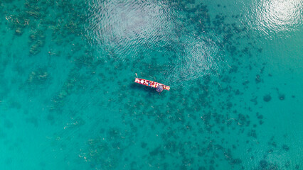 Pig trough boats on the lake, Lugu Lake in Yunnan, China