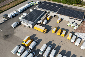 Electric delivery vans and trucks hub using renewable energy. Fleet of electric vehicles