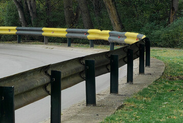 Curve of the Street — Black and Yellow Fence Divider.