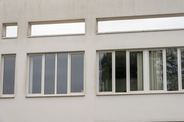 Modernist building facade showcasing geometric windows architecture