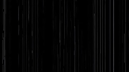 Delicate streaks of light cascade down a dark background creating an abstract and ethereal atmosphere.